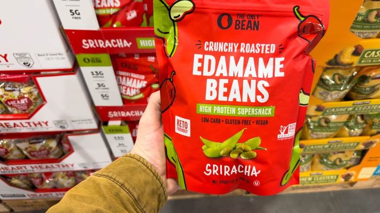 person holding roasted edamame