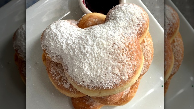 Mickey-shaped beignets on a plate