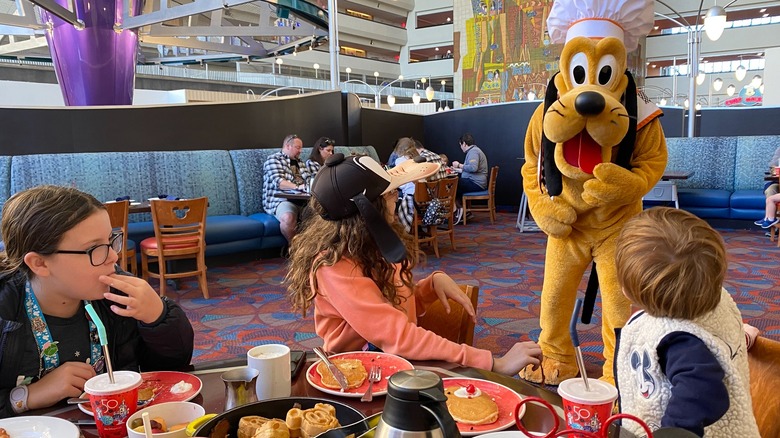 Kids eating and meeting Pluto