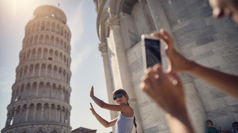 tourist taking photo in Pisa