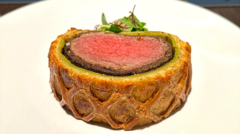 Sliced beef Wellington on a plate