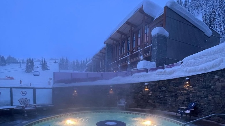 View of the Sunshine Mountain Lodge and hot tub in Canada