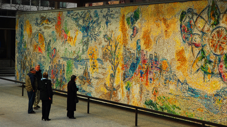 People in front of Chagall mural