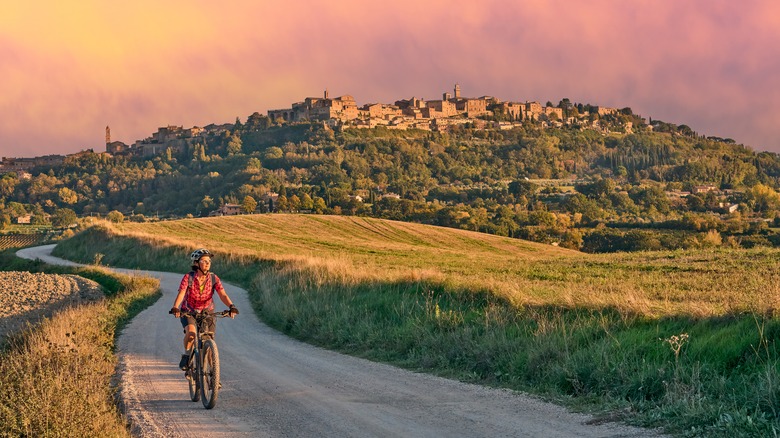 woman riding bike in Tuscany
