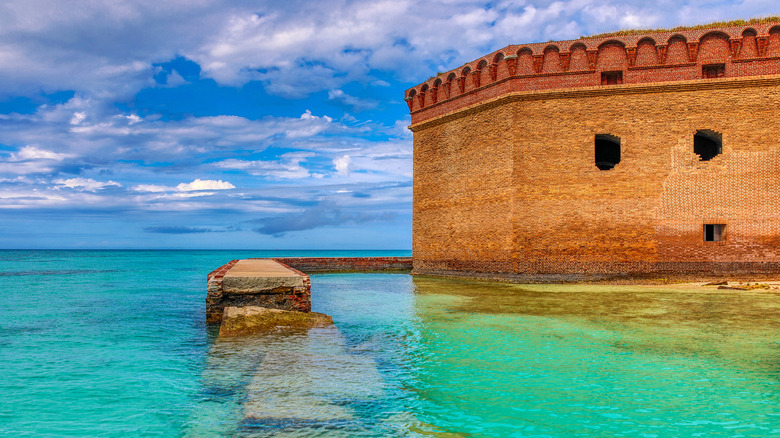 orange building on clear water