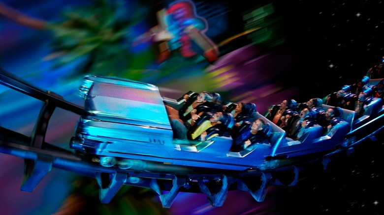 Guests riding Rock 'n Roller Coaster