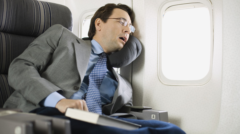 person sleeping on a plane