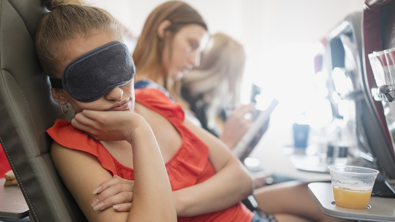 person sleeping on a plane