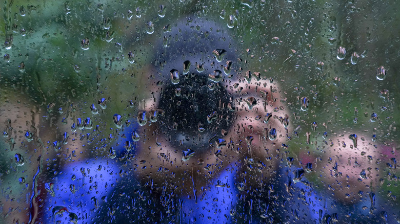 Photographer taking photo in rain