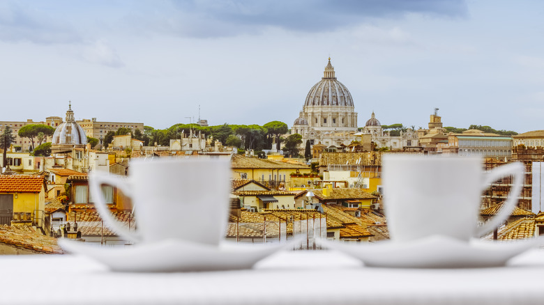 Coffee cups and view of Rome