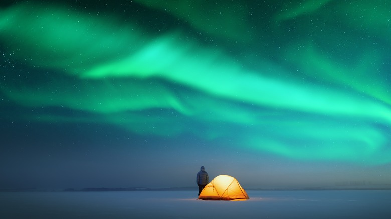 Camper under northern lights