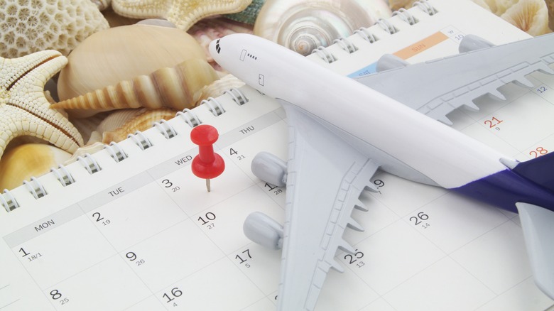 Model airplane on calendar  