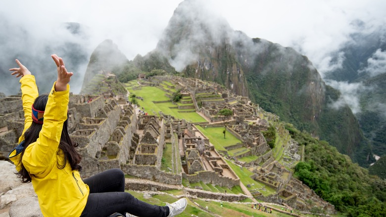 Woman celebrating making it to Machu Picchu