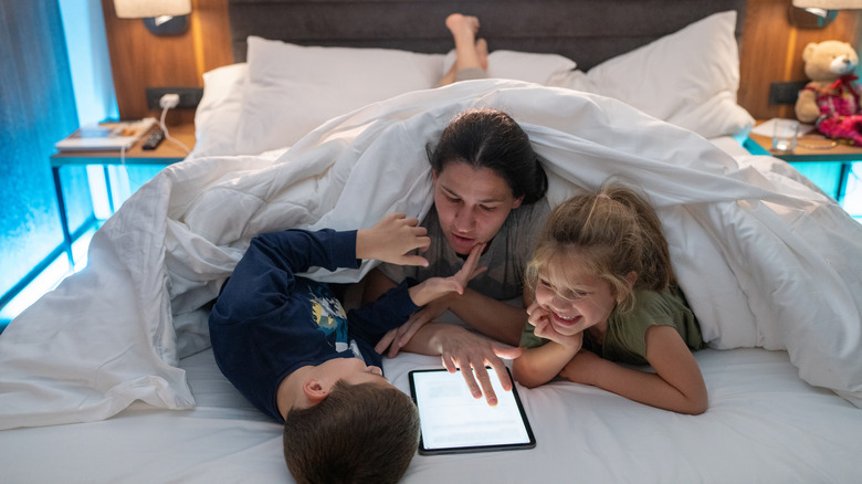 Family in hotel bed