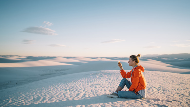 Woman photographing White Sands National Park 