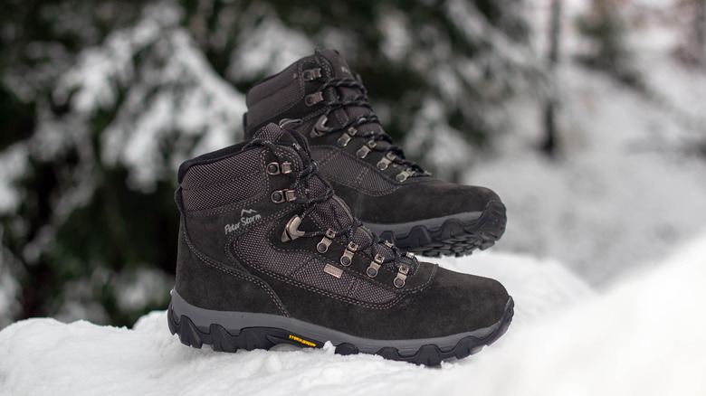 Boots stand in snowy woods
