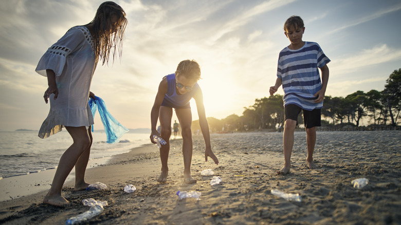 Cleaning up plastic on beach