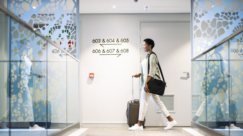 Woman walking with luggage