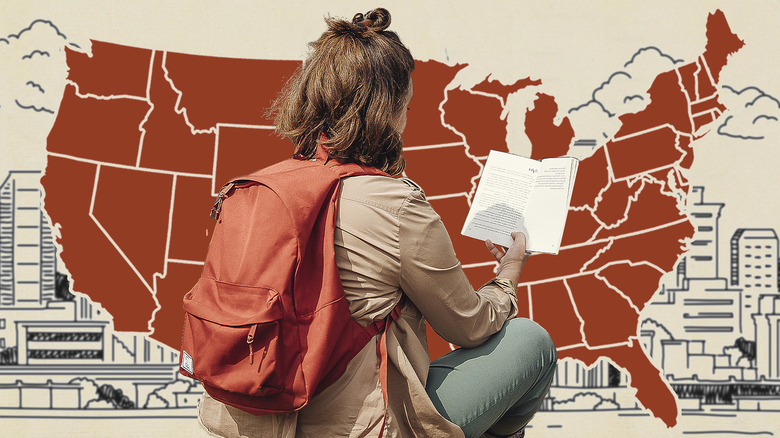 Woman with backpack holding book map