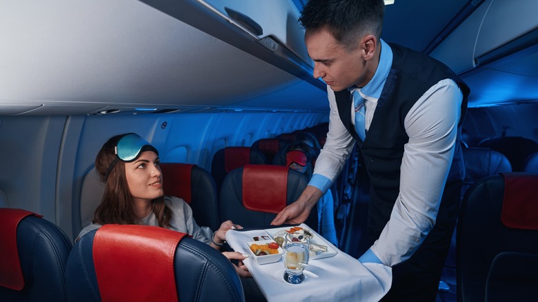 flight attendant serving food