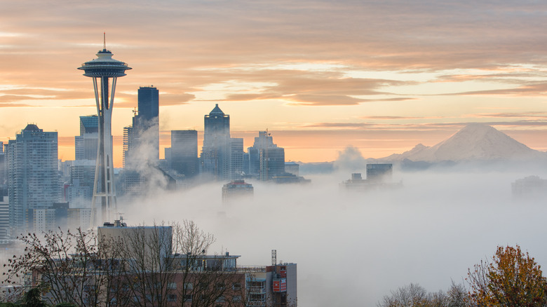 Space needle clouds mountain