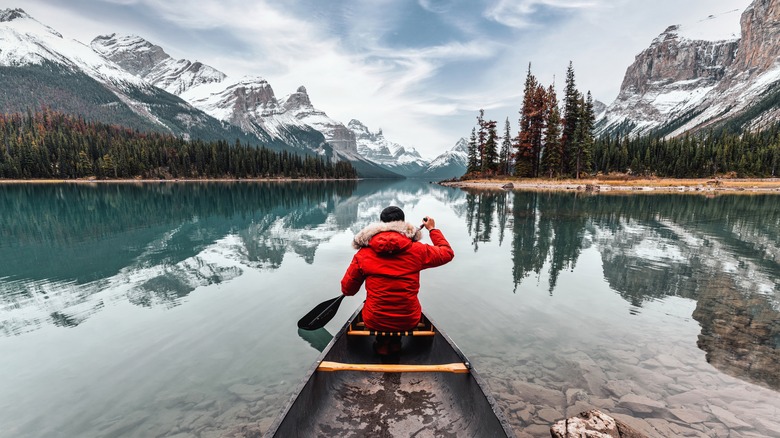 Canoeing on lake in winter