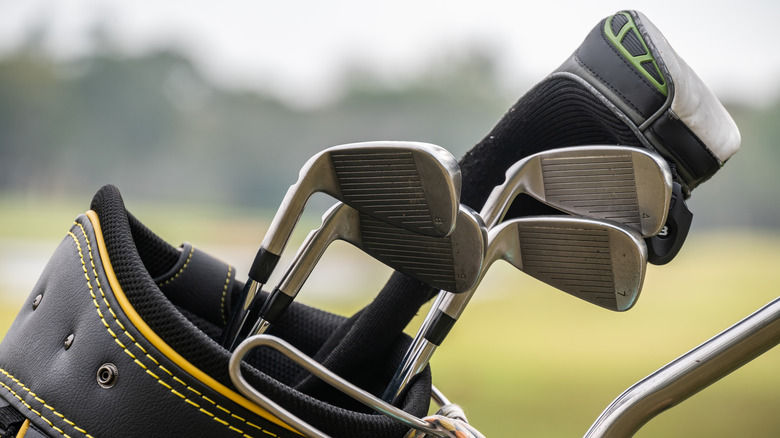 Close-up of a golf bag and clubs