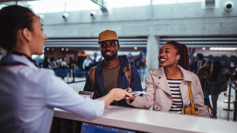 A couple checking in for a flight