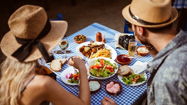 Couple enjoying Greek appetizers