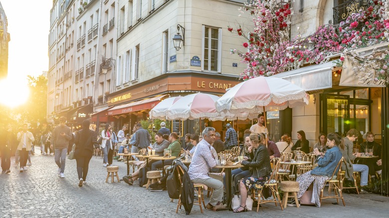 Travelers dining outside at a French restaurant