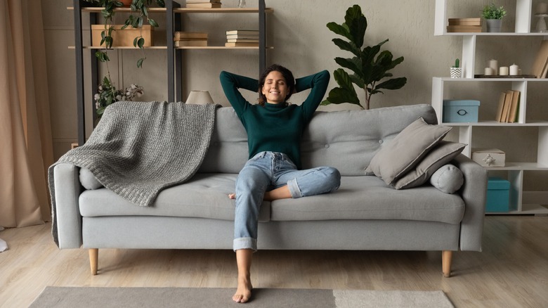 woman relaxing in clean home