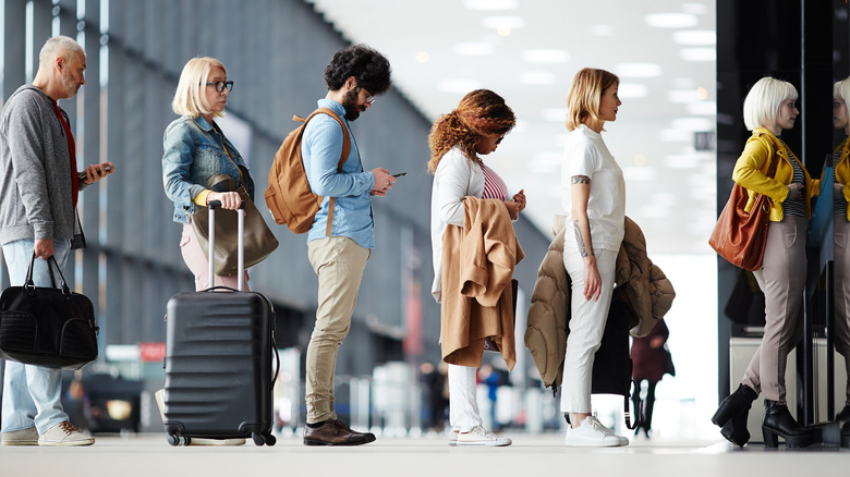 Travelers in line at airport