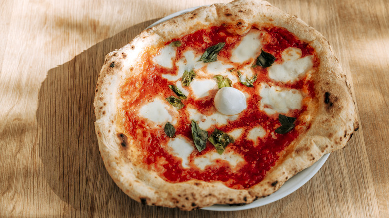 Italian pizza on wooden table