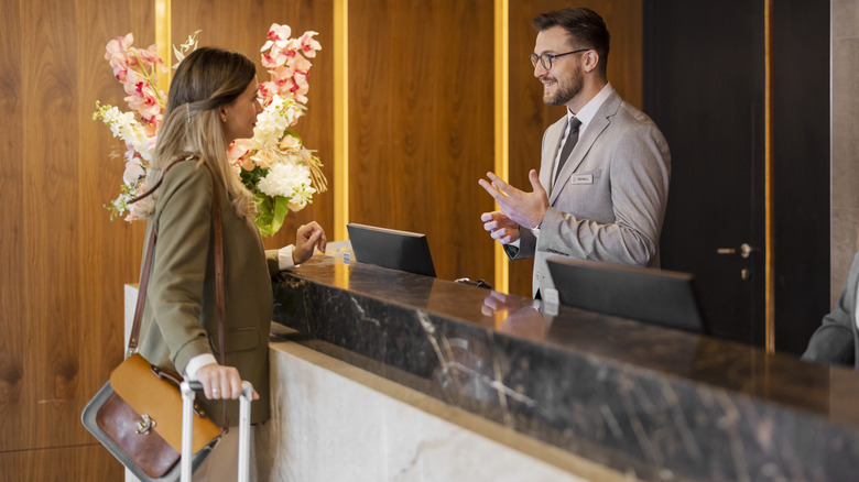 Woman checking in at hotel