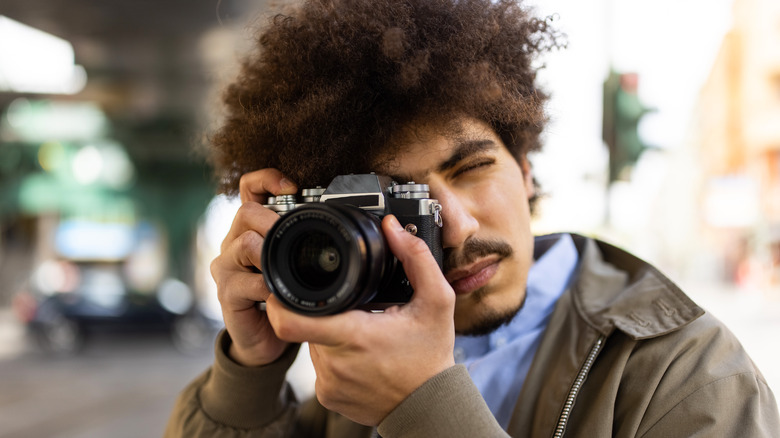 Man taking photos with camera