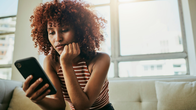 Woman looking at cell phone