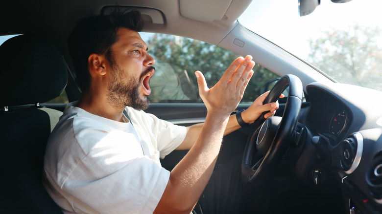 angry man driving car