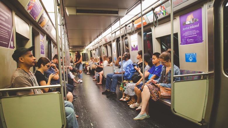 Passengers sit on the Boston subway 