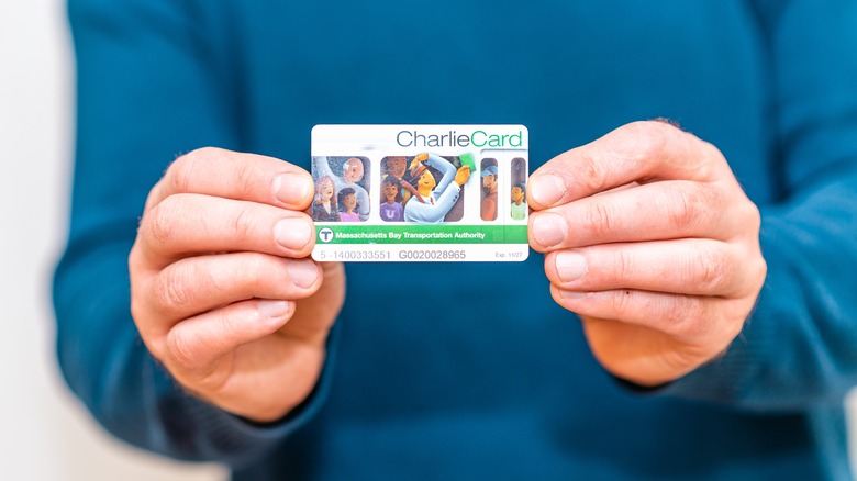 A man holds a CharlieCard