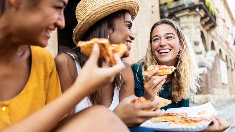 eating pizza in italy