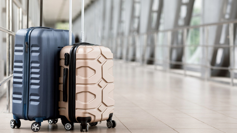 two suitcases in an airport