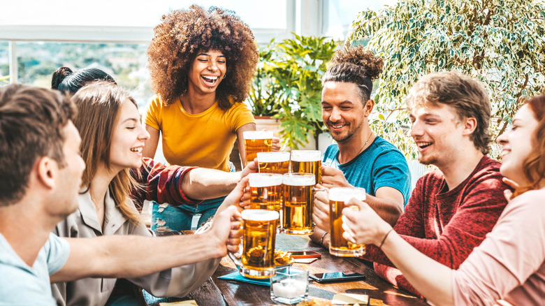 Travelers having a beer at their hostel