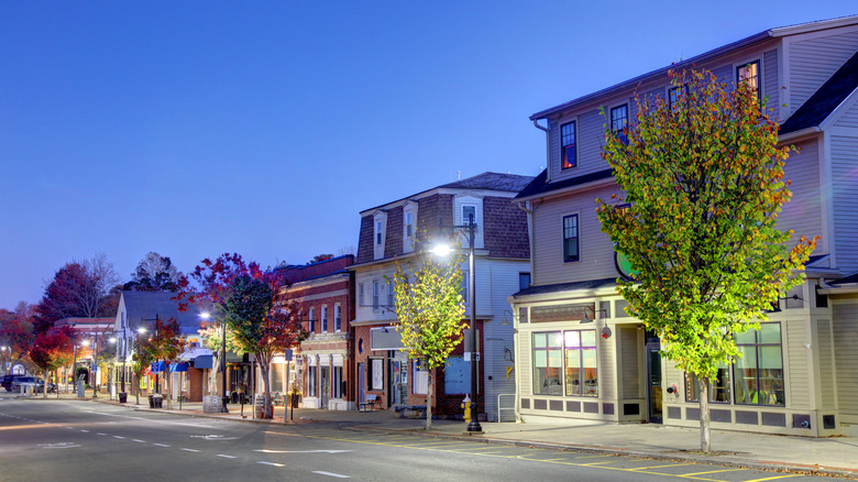 Street with clapboard and red brick buildings