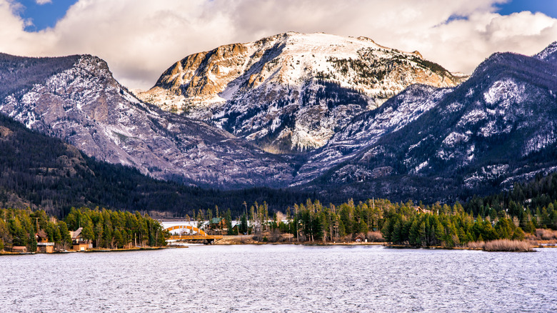 Snow-covered mountains tower over Lake Granby