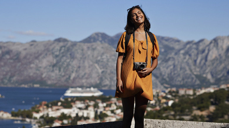 Smiling traveler posing for photo