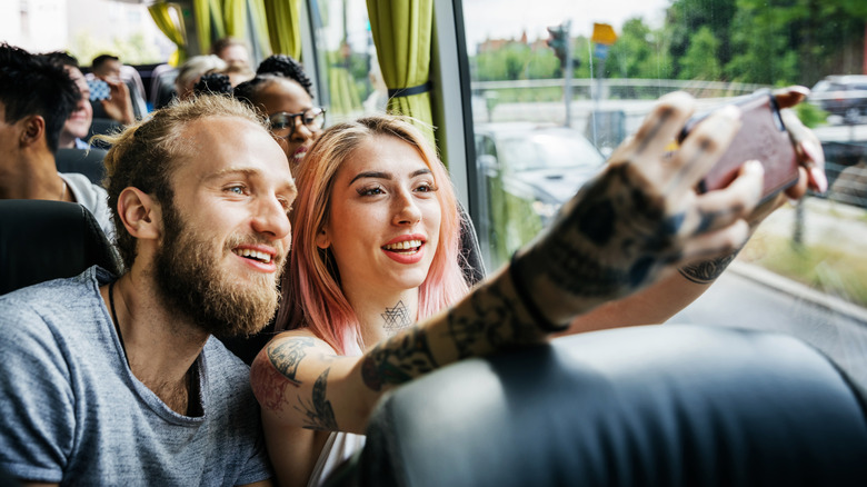 Tour bus passengers taking selfie