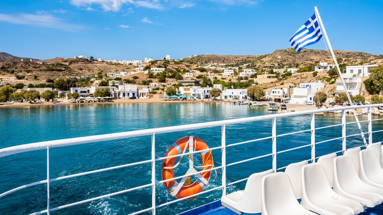 View of a Greek island from a ferry on a sunny day