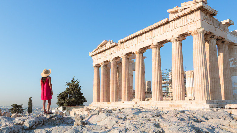 woman admiring Greek ruins