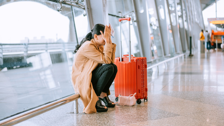 unhappy woman in airport