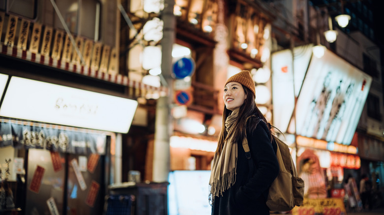 Traveler looking up on Japanese street